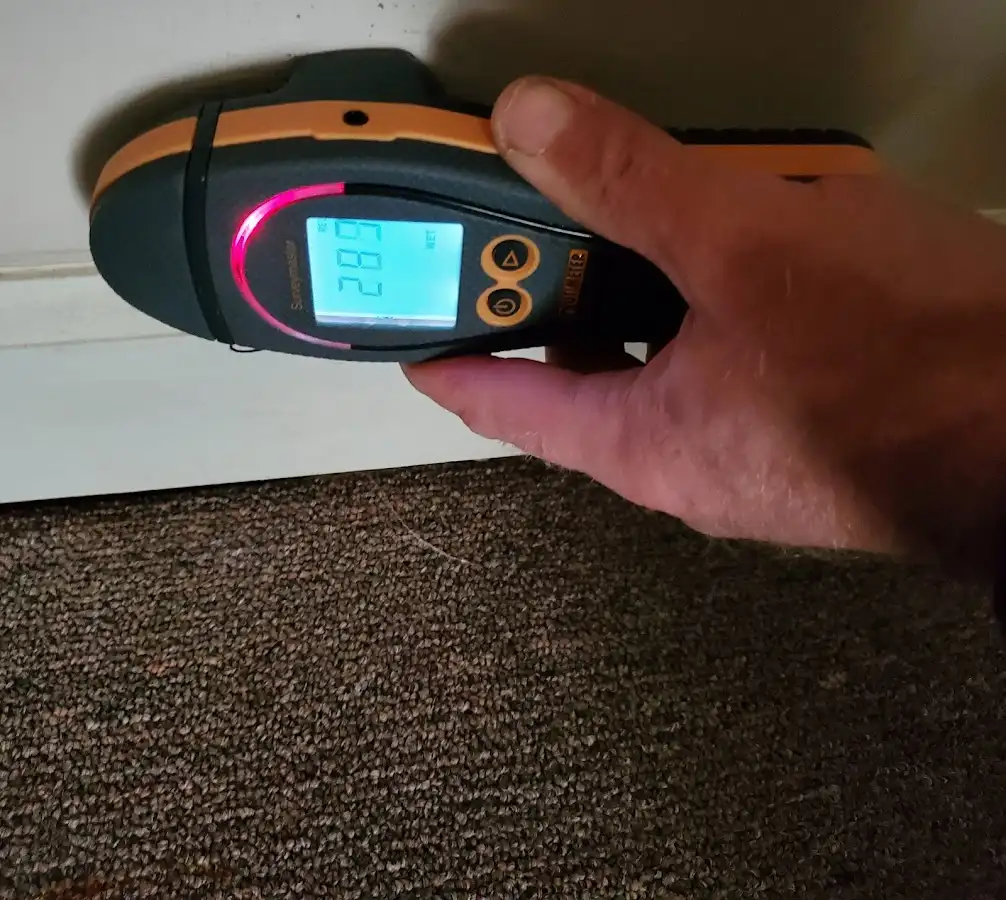 Moisture detection at baseboard during Storm Damage Restoration in Gadsden